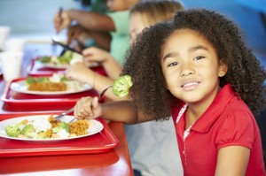 5345549-elementary-pupils-enjoying-healthy-lunch-in-cafeteria